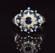 A 9ct white gold ring set with sapphires and diamonds in a cluster, 4.5g, size J