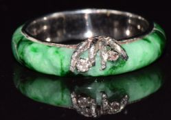 A c1920 18ct white gold ring set with jadeite and diamonds, 4.1g, size M