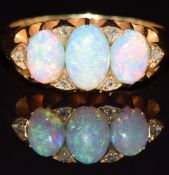 Edwardian 18ct gold ring set with three opal cabochons and rose cut diamonds, Birmingham 1903, 5.7g,