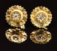 A pair of c1900 earrings each set with a diamond, 1.7g