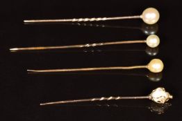 Four 9ct gold stick pins each set with a pearl, 4g