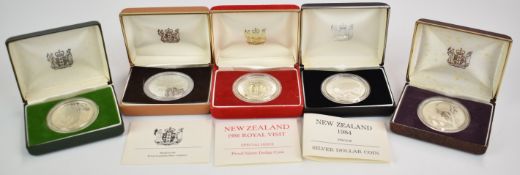 Five New Zealand silver dollars, some proof, in cases