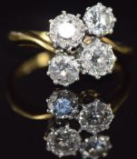 An 18ct gold ring set with four round cut diamonds, total diamond weight approximately 1.5ct, 5.