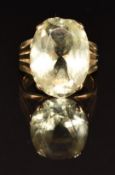 A 9ct gold ring set with an oval cut citrine, 5.6g, size L