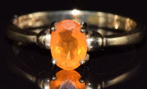 A 9ct gold ring set with a fire opal, 1.8g, size N