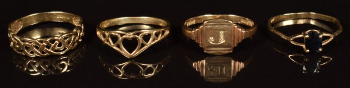 Four 9ct gold rings, one set with a sapphire, 5.2g