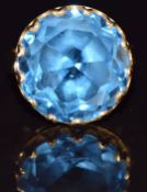 An 18k gold ring set with a round cut topaz, 8.5g, size L