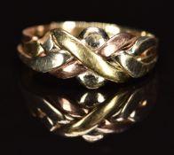 A 14k gold tri-coloured knot / puzzle ring, 3.0g, size S