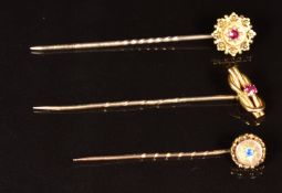 A 15ct gold stick pin set with a ruby (1.7g), 9ct gold Victorian stick pin set with a ruby and a 9ct