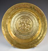 19thC Arts & Crafts brass charger with hammered decoration, diameter 41cm, on stand