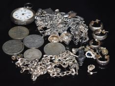 A silver curb link necklace, coins, silver fob watch, six pairs of silver earrings and a silver