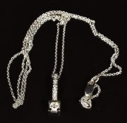 An 18k white gold pendant set with diamonds, the largest diamond approximately 0.15ct, on 18k