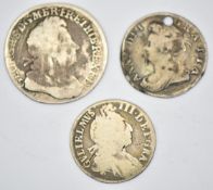 William III sixpence, 1705 Queen Anne sixpence (pierced) and a 1723 George III South Sea Copper