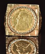 A 9ct gold ring set with a 1984 gold 1/10 Krugerrand, 9.9g, size S