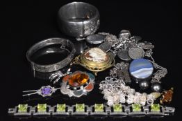 A collection of silver jewellery including Scottish agate brooch, curb link bracelet, brooches,