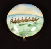 A 19th/20thC 9ct gold and enamel roundel decorated with figures in a dugout canoe, probably
