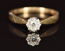 A 9ct gold ring set with a diamond in an illusion setting, 1.8g, size M