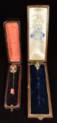 Two Victorian stick pins, one set with turquoise and engraved decoration and one faceted decoration,