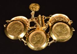 A 21ct gold bracelet set with four gold full sovereigns comprising 1909 and 1911 with Perth Mint