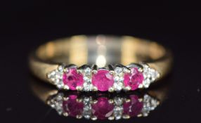 A 9ct gold rings set with rubies and diamonds, 2.6g, size T