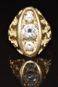 A 9ct gold ring set with three cubic zirconia, 10.2g, size X