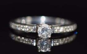 An 18ct white gold ring set with a diamond of approximately 0.2ct with diamond encrusted