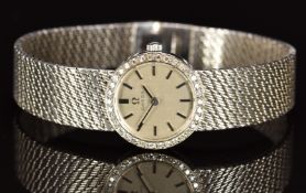 Omega 18ct white gold ladies wristwatch ref. 7185 with black hands and baton hour markers, silver