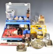 A collection of items for the amateur watch or clock repairer, includes tools and parts including