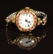 Edwardian 18ct gold wristwatch set with rubies and seed pearls