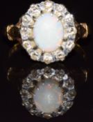 An 18ct gold ring set with an opal and diamonds, 5.5g, size O/P