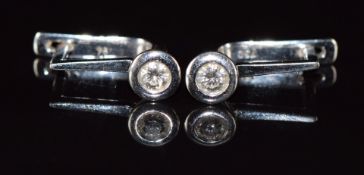 A pair of 18k white gold earrings each set with a diamonds of approximately 0.18ct, 4.6g