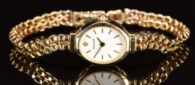 Accurist 9ct gold ladies wristwatch with gold hands and hour markers, white dial and quartz