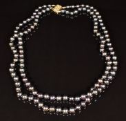 A double strand Tahitian pearl necklace with 14K gold clasp.