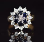 A 9ct gold ring set with sapphires and diamonds in a cluster, 4.7g, size M