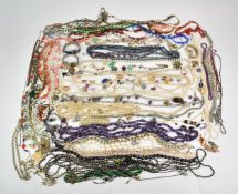 A collection of costume jewellery including amethyst necklace, three coral necklaces, four