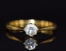 An 18ct gold ring set with a round cut diamond of approximately 0.25ct, 2.6g, size K