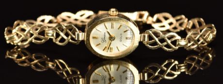 Unnamed 9ct gold ladies wristwatch with gold hands and baton hour markers, silver dial and quartz
