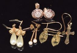 Two pairs of 9ct gold earrings, one pair set with a pearl to each, a yellow metal pair of earrings