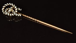 Victorian 9ct gold stick pin set with enamel in the form of a lover's knot, 4.6g