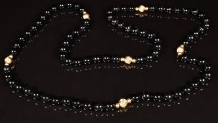 A beaded onyx necklace interspersed with 9ct gold beads