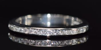 A platinum half eternity ring set with diamonds, 4.8g, size P