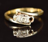 An 18ct gold ring set with diamonds in a platinum setting (one diamond missing), 1.8g, size J