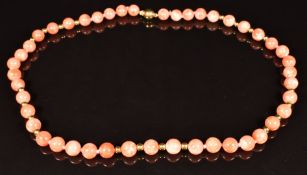 A beaded coral necklace with 18ct gold clasp and beads