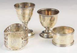 Two hallmarked silver napkin rings and two hallmarked silver egg cups, weight excluding example with