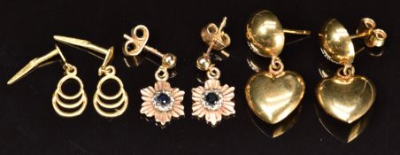 Three pairs of 9ct gold earrings, one pair set with a sapphire to each, 3.9g