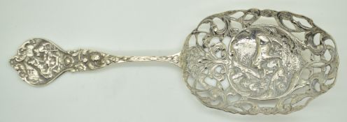 Dutch silver serving spoon with traditional scene of cattle and Dutch silver marks to bowl, length