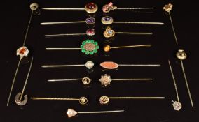 Fifteen Victorian stick pins including paste set, knot design, horseshoe and shield and six other