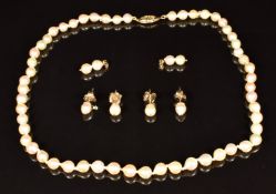 A cultured pearl necklace with 14k gold clasp and two pairs of 9ct gold and pearl earrings