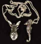 Two hallmarked silver pendants, one in the form of a seahorse and the other a hare on silver chains,