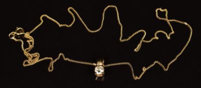 A 9ct gold pendant set with a diamond of approximately 0.24ct, on a 9ct gold chain, 1.2g